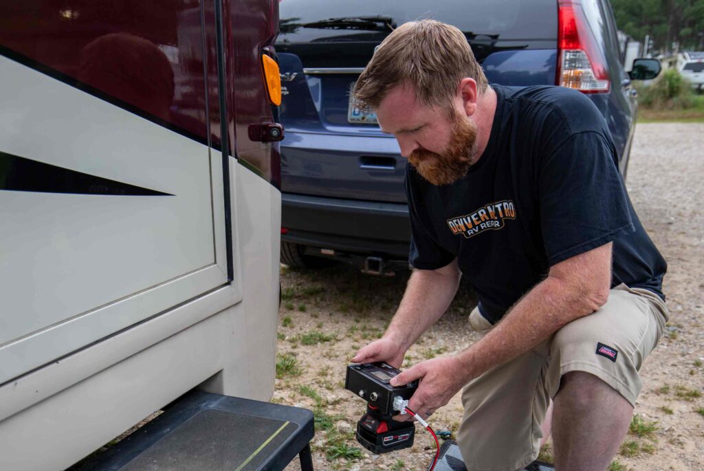 RV repair technician servicing camper in Thornton CO